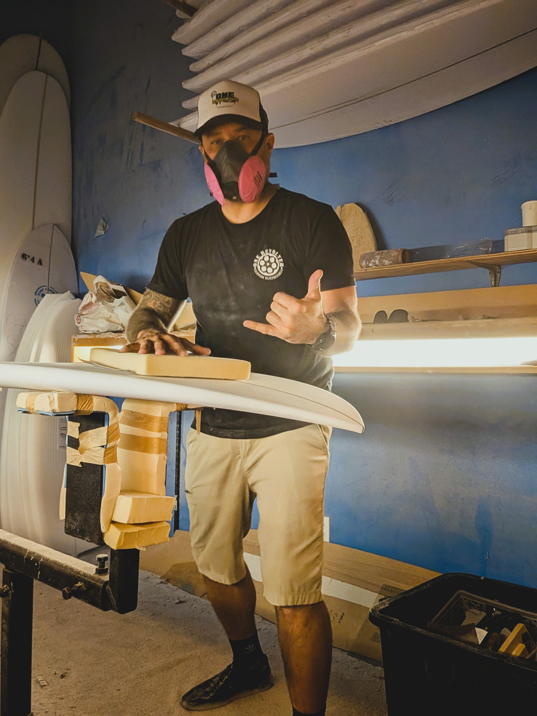 Brian Wright shaping a custom surfboard by hand at Pure Glass in Costa Mesa