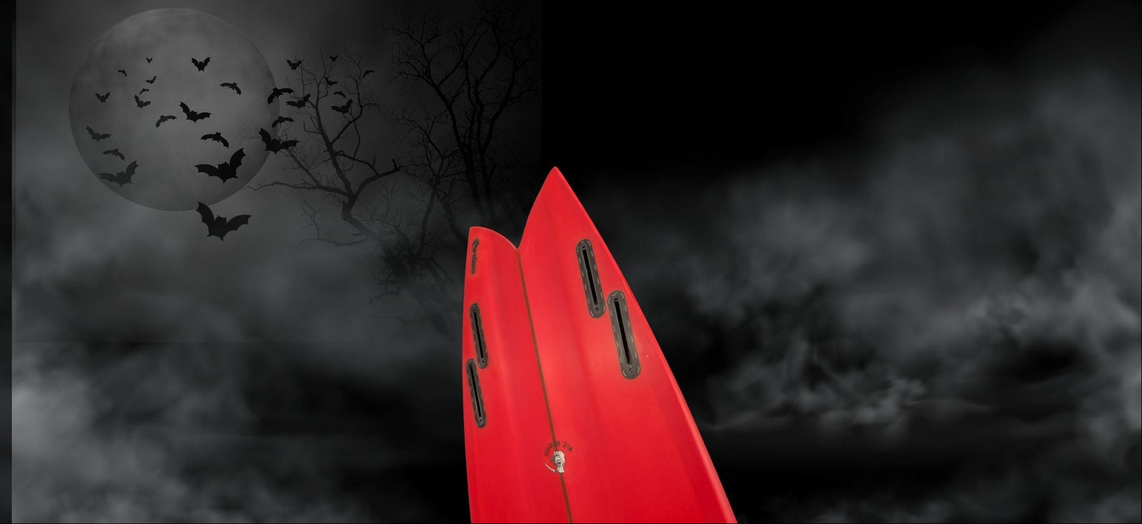 red swallow tail reaper fish model in misty spooky scene with bats