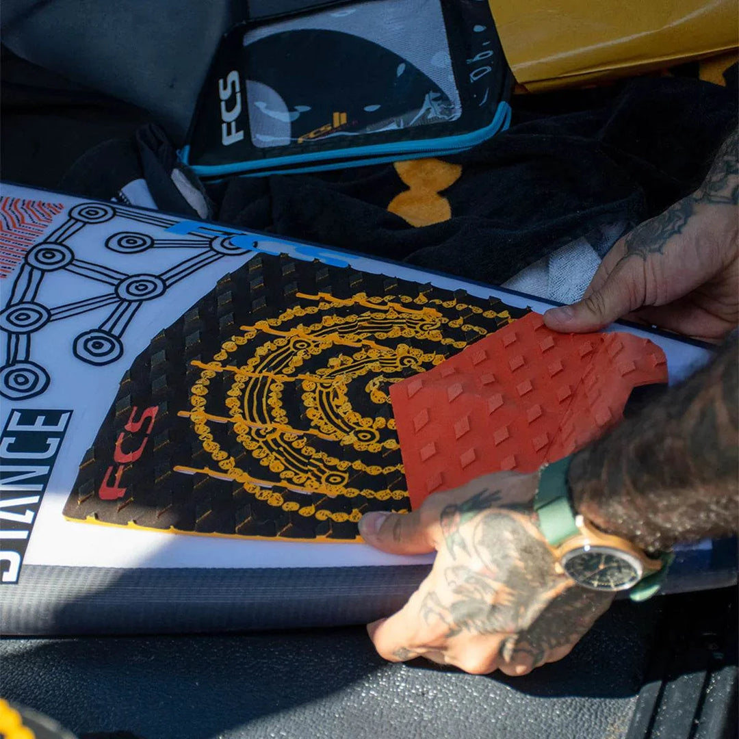 a close up of a person holding a surfboard