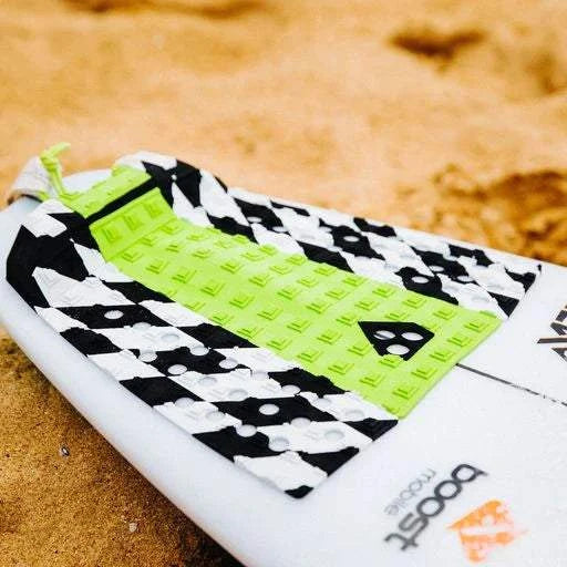 a surfboard laying on the sand on the beach